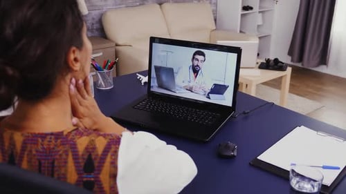 Woman Talks With Doctor During Telehealth Appointment