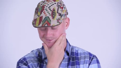 Face of Stressed Young Hipster Man Thinking and Looking Down