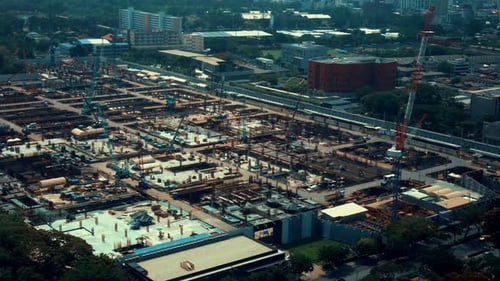 Large Construction Site with Heavy Construction Machinery in Metropolis