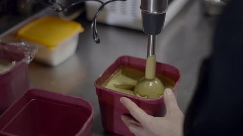 Using Handheld Immersion Blender to Mix Food