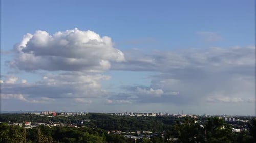 Clouds over Distant Cityscape on a Clear Day