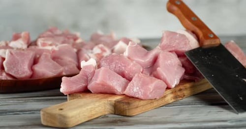Sliced on a Cutting Board Raw Pork Kebab Rotates.