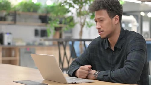 Young Adult in Video Call at Workplace