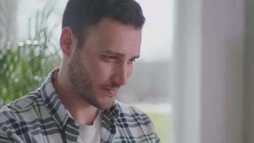 Young Man in Plaid Shirt Close Up Indoors