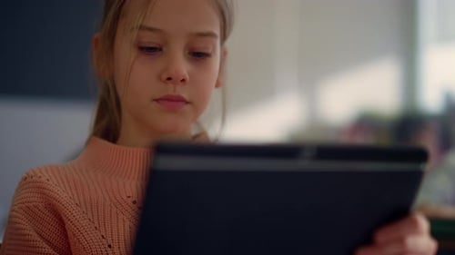 Girl Getting Education with Modern Gadget