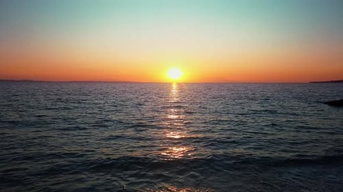 Sonnenuntergang an der Ägäis, Sonne, Land in der Ferne, Wasser, Griechenland