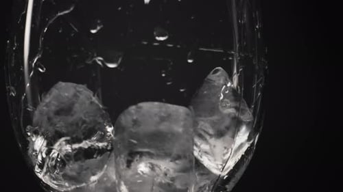 Ice Cubes in Wet Glass Close Up