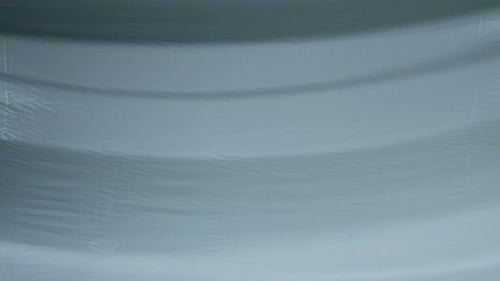 Subtle Ripples on Light Gray Abstract Background