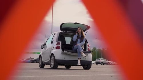 Woman Talking on Phone in Back of Car