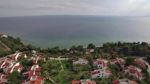 - Resort Area with Cottages on the Coast of Vast Blue Sea, Aerial