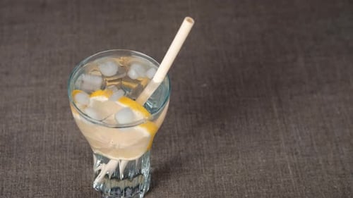 Lemon Drink With Ice and Straw Close Up