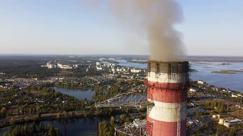 Environmental pollution by industrial plants throwing out harmful smoke from the chimney