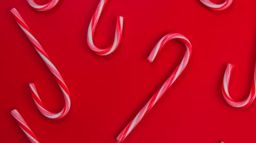 Rotating Red Christmas or New Year Background in Traditional Candy Cane