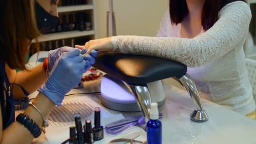 Nail Technician Giving Manicure in Beauty Salon