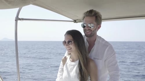Romantic Couple Sailing on a Small Boat in Ocean