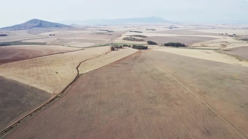 Large Farming Field By the Countryside with a View of the Mountain