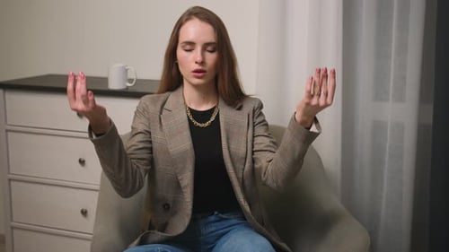 Mindful Calm Beautiful Businesswoman Do Yoga Exercise Take Break Relax Eyes Closed at Home Office