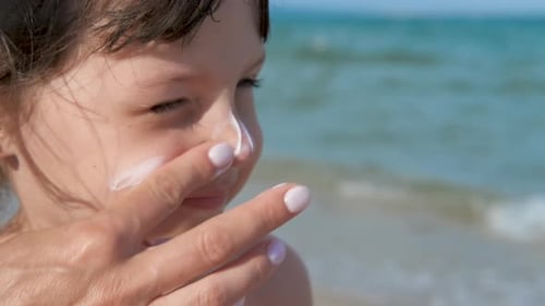 The face of a child in sunscreen.