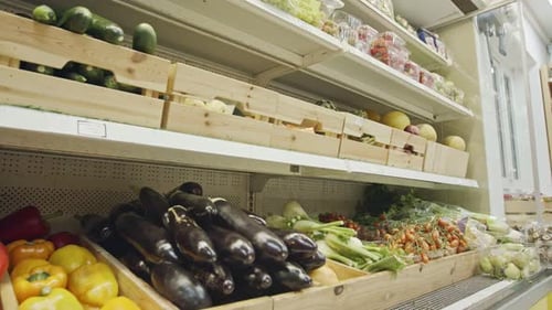Large variety of vegetables and fruits on a supermarket shelves