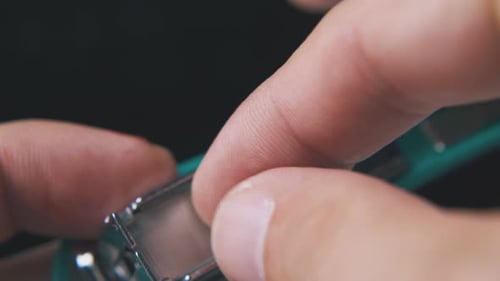 Refilling Turquoise Stapler with Staples Close-Up