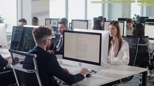 Modern Open Space Corporate Office with Tow Rows Off Businessmen and Businesswomen Working on