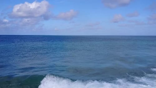 Aerial drone seascape of shore beach trip by clear ocean with sand background