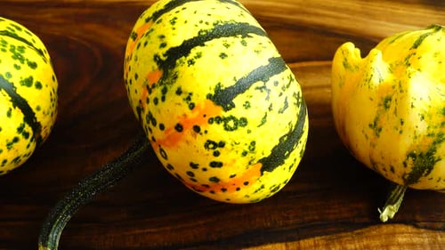 Decorative Gourds on Wooden Surface