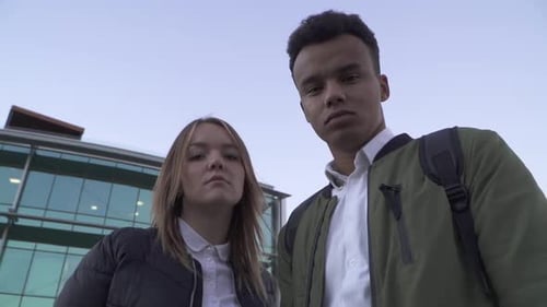 Portrait of Interracial Couple Standing on the Background of the Business Center