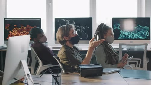 Team Meeting in Office Wearing Face Masks