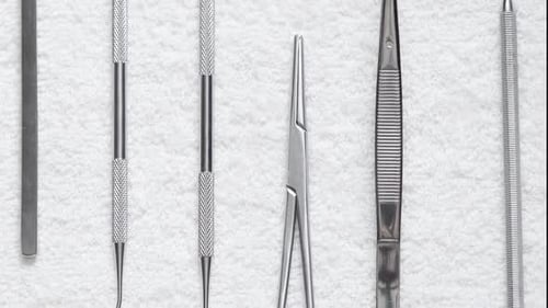 Stomatology and Surgery Tool on a White Napkin. Moving Background. Close Up Footage.