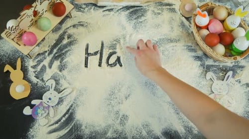 Writing Happy Easter Message in Flour