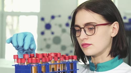 Young Adult Lab Worker Inspecting Samples