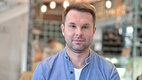 Man Expressing Surprise Indoors Close Up