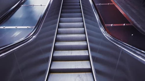 Pedestrian Crossing Escalator Goes Without People. Automatic Stairs Moving Up