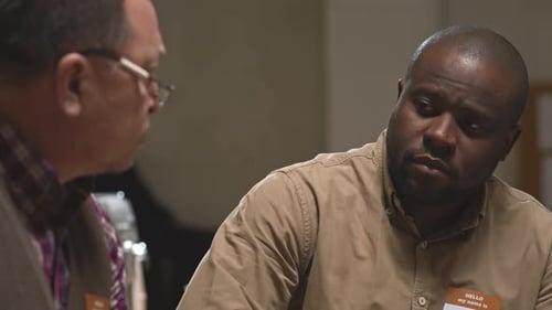 Men in Office Engaged in Conversation