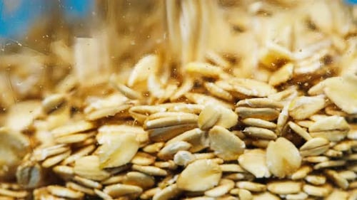 Rolled Oats Filling a Glass Container