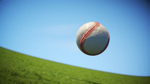 Baseball flying fast through the air in slow motion above the field grass 4KHD