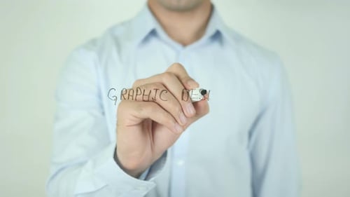 Man Writes Graphic Design on Clear Surface