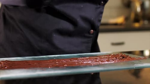 Delicious Chocolate Being Prepared by Gloved Confectioner