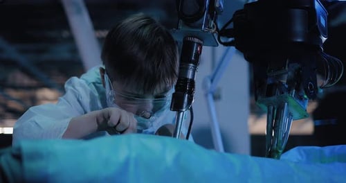 Child Engineer Works with Futuristic Robot Device