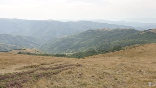 Slow tilt on Midzor peak valley by the day 4K 2160p 30fps UltraHD footage - Mountain ranges and beau