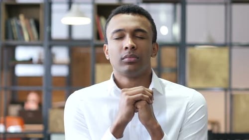Praying Black Man in Office