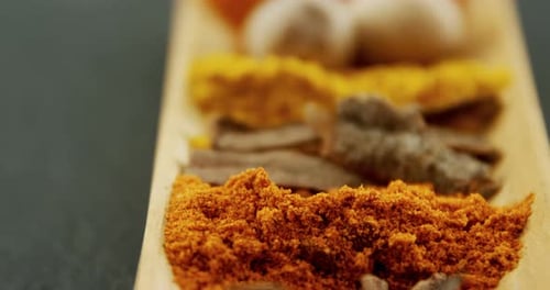 Spice Assortment on Wooden Platter