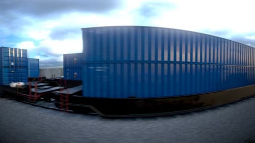 Freight Train with Blue Shipping Containers Moving Fast