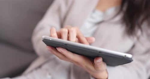 Adult Using a Tablet at Home