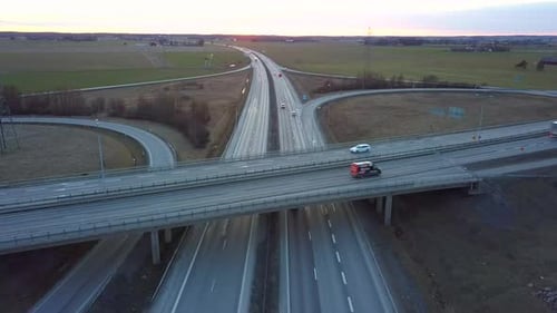 Aerial View of Freeway Intersection with Moving Traffic Cars