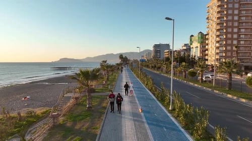 People walk around the embankment