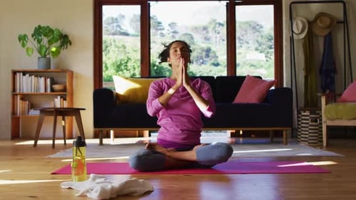 Woman Practicing Yoga in a Serene Home