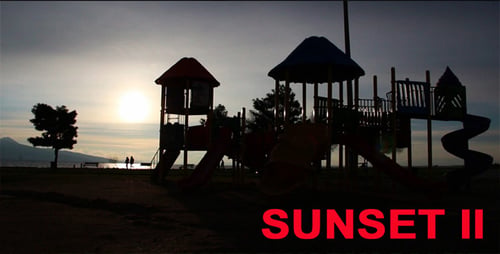 Silhouetted Playground on Beach at Sunset