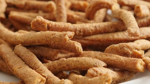 Slow tilt on grissini tasty snack made of dough with chilli 4K 2160p 30fps UltraHD footage - Tiltin